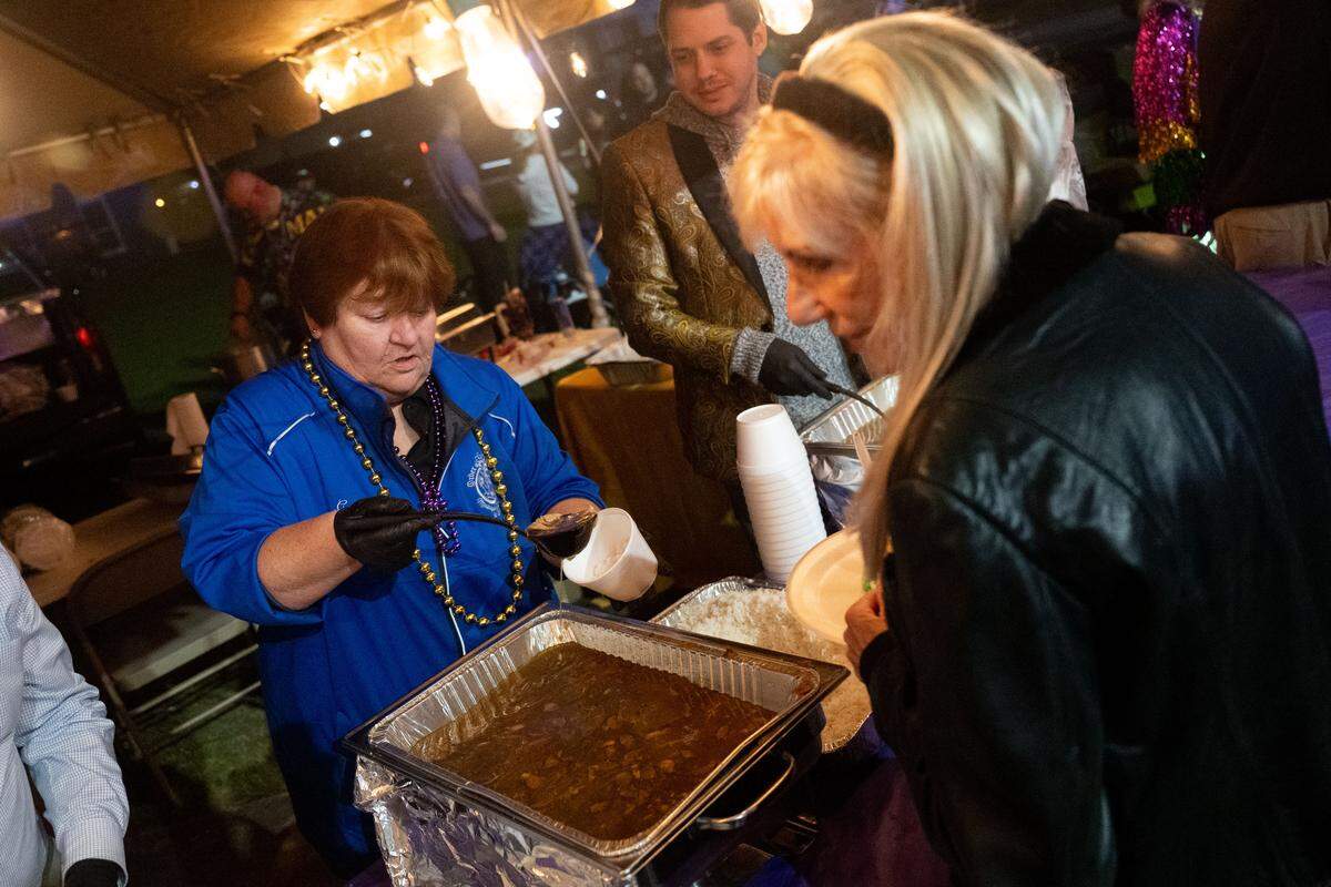 Kelly Gentry serves free gumbo for event attendees during a 12th Night Celebration in Biloxi on Monday, Jan. 5, 2026.