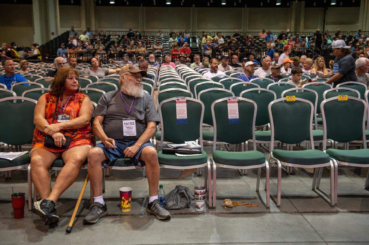 Potential bidders watch as cars are auctioned off during the Vicari car auction at Mississippi Coast Coliseum and Convention Center on Thursday, Oct. 7, 2021.