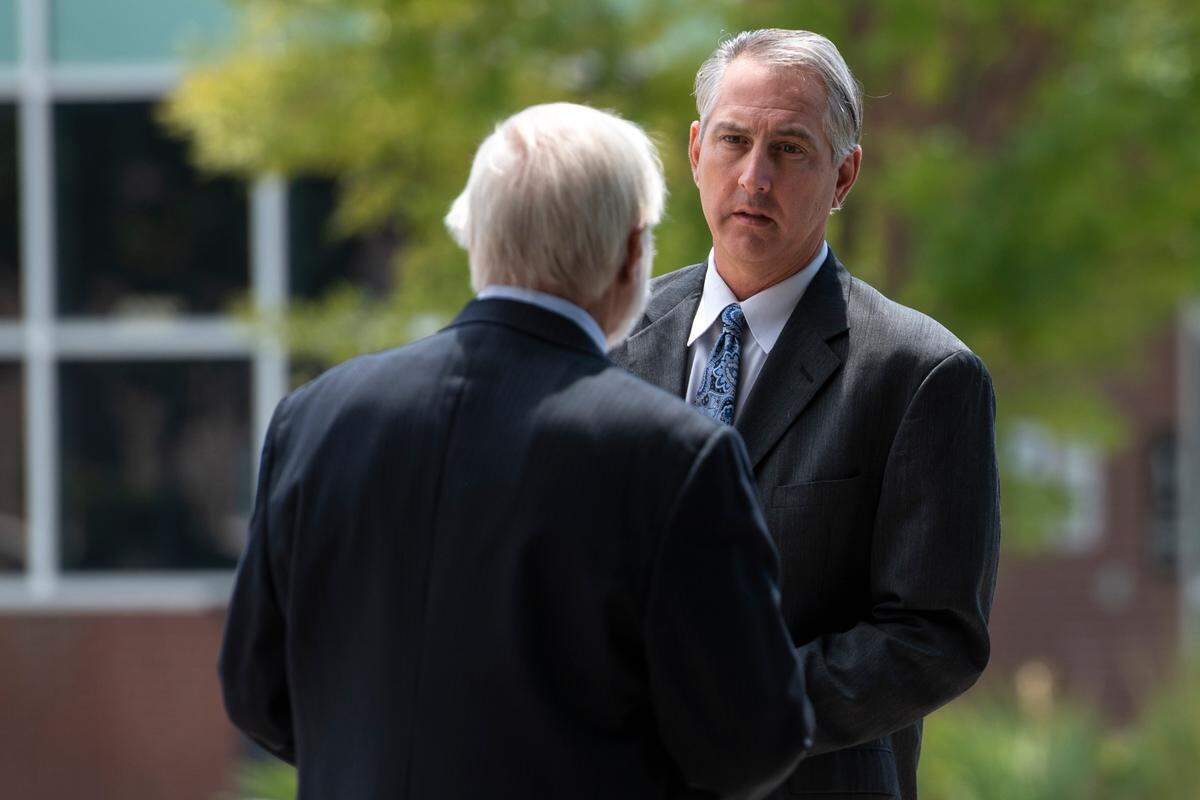 Clell Rosetti, owner of Quality Poultry and Seafood, left, and Todd Rosetti, sales manager at Quality Poultry and Seafood, right, talk outside of Dan M. Russell Jr. Courthouse in Gulfport on Tuesday, Aug. 27, 2024, after pleading guilty to conspiring with Mary Mahoney’s Old French House to mislabel cheaper foreign fish as Gulf seafood.