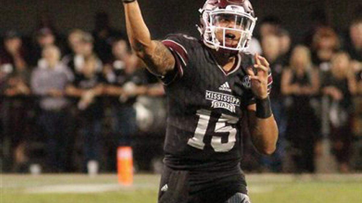 Mississippi State quarterback Dak Prescott (15) throws a pass during the first half of an NCAA college football game against Kentucky in Starkville, Miss., Saturday, Oct. 24, 2015. (AP Photo/Jim Lytle)