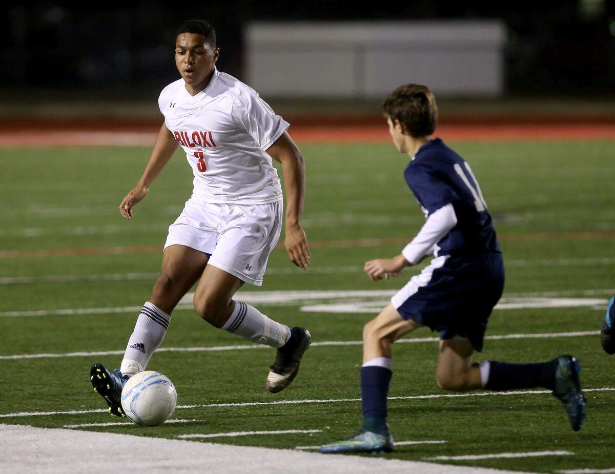 AMANDA McCOY/SUN HERALD  Biloxi's Koray Easterling dribbles the ball down the field while competing against Hancock High on Friday, January 15, 2016, at Biloxi High.