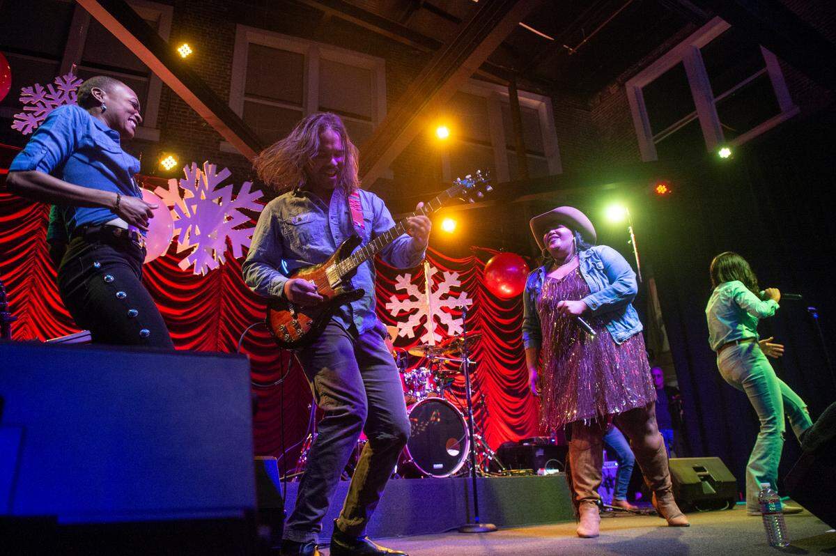 Chapel Hart dances with one of their guitarists during their performance at Ground Zero Blues Club in Biloxi on Wednesday, Nov. 30, 2022.