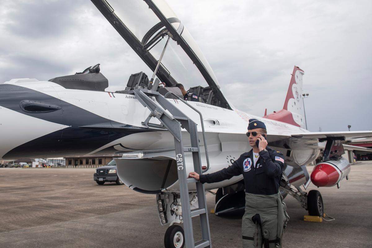 Advance Pilot and Narrator Maj. Jeff Downie takes a call as he prepares a Thunderbird F-16 aircraft for flight at the Combat Readiness Training Center at Gulfport International Airport on Friday, Feb. 10, 2023. The Thunderbirds will return to the Mississippi Coast April 28 to April 30, 2023.