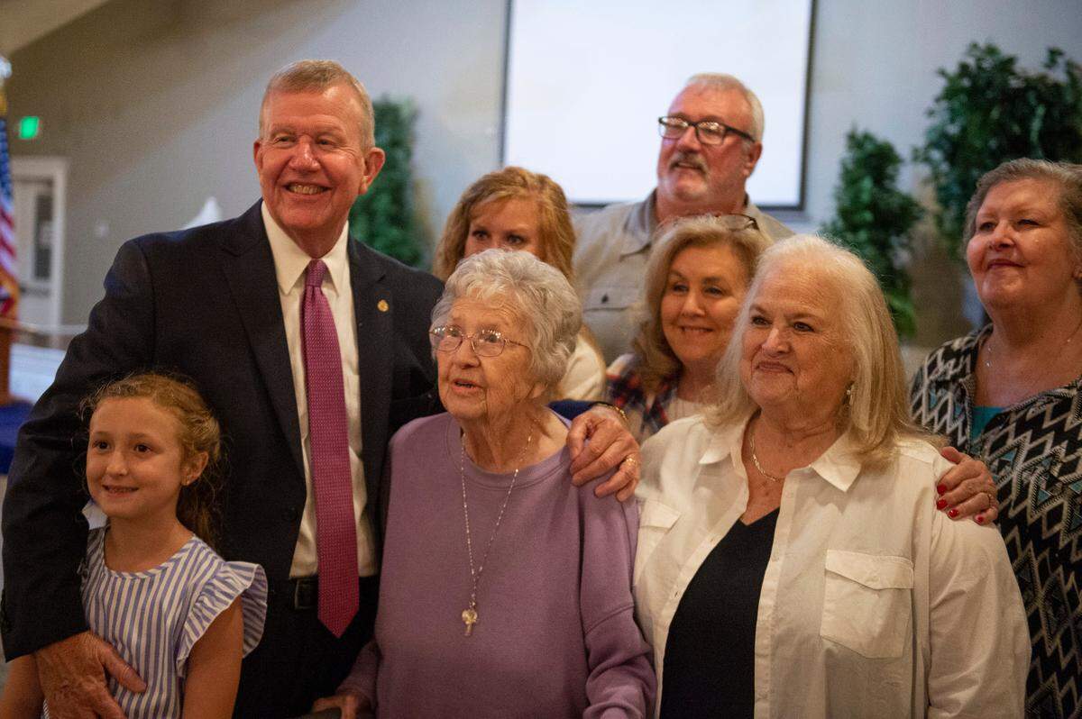 Sheriff Mike Ezell poses for photos with family after winning the primary runoff election for Mississippi’s 4th Congressional District at The Grand Magnolia Ballroom in Pascagoula on Tuesday, June 28, 2022.