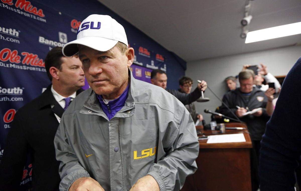 LSU head coach Les Miles leaves a media availability with reporters following an NCAA college football game against Mississippi in Oxford, Miss., Saturday, Nov. 21, 2015. No. 25 Mississippi won 38-17. (AP Photo/Rogelio V. Solis)