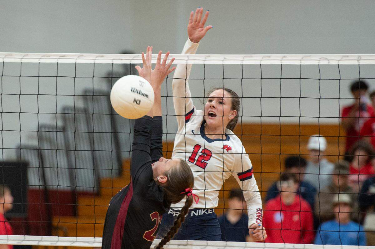 Hancock’s Anslee James blocks the ball during the 6A South State Championship game at Hancock High School in Kiln on Monday, Oct. 16, 2023.