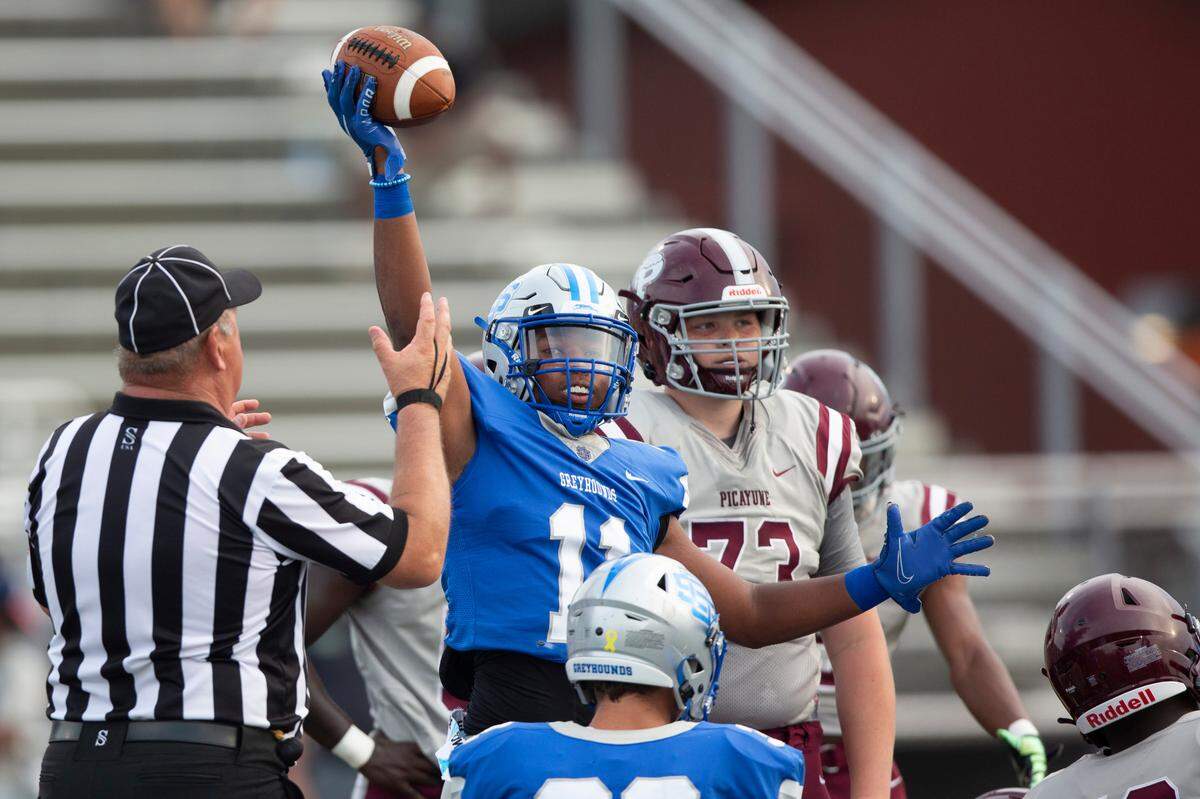 Ocean Springs’ Eric Moore cheers as he recovers the ball from Picayune during a spring game at Greyhound Stadium in Ocean Springs on Friday, May 13, 2022.