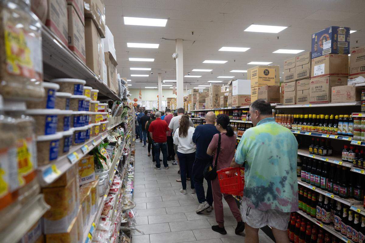 The line for king cakes stretched deep into the store Friday after doors opened at Lee’s International Supermarket.