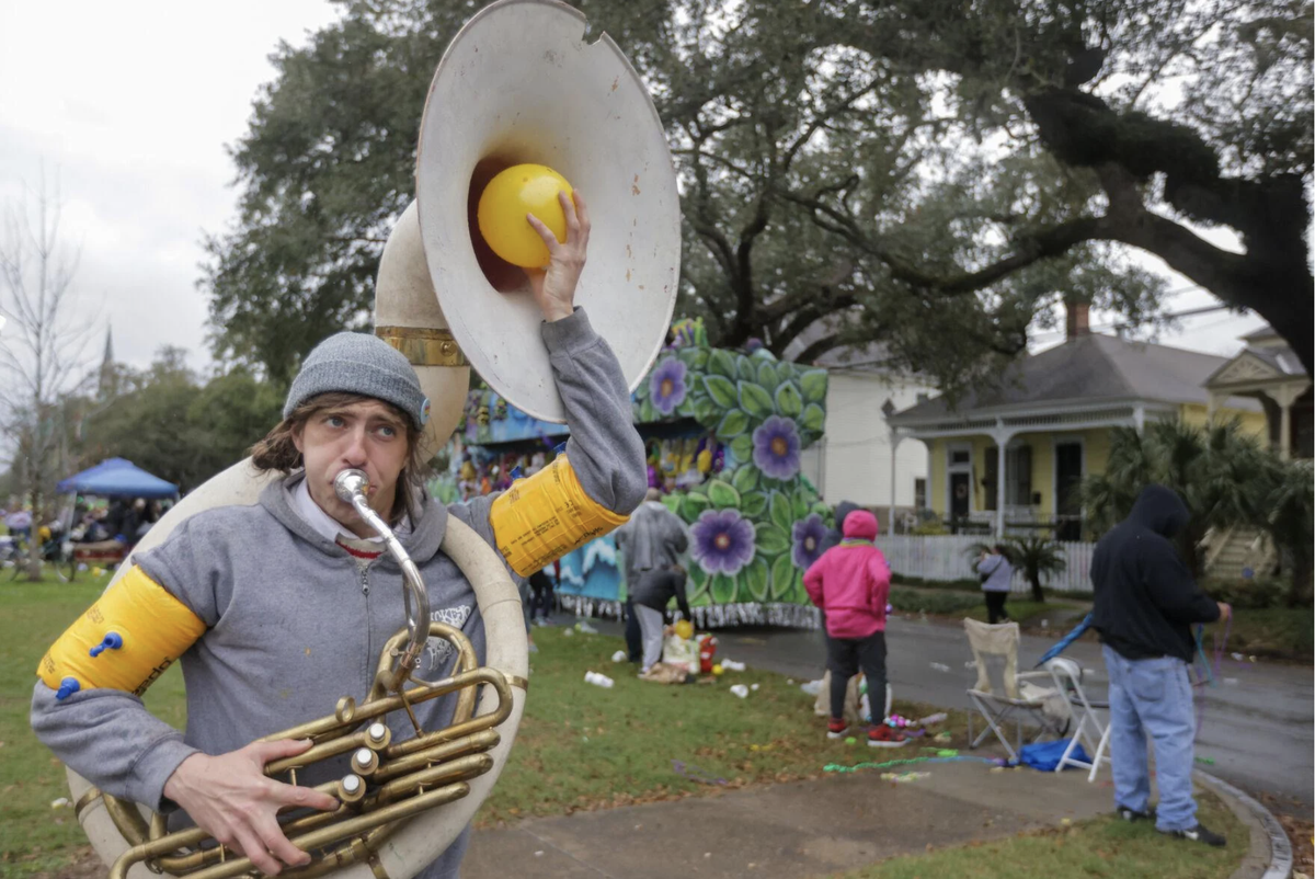 Adam Lessnau plays a sousaphone as the Krewe of Choctaw rolls during its annual parade on the Uptown route in New Orleans on Saturday, February 11, 2023. The krewe, which moved from the West Bank to the Uptown route 10 years ago, features 14 floats with the theme “Life is a Fairy Tale.”