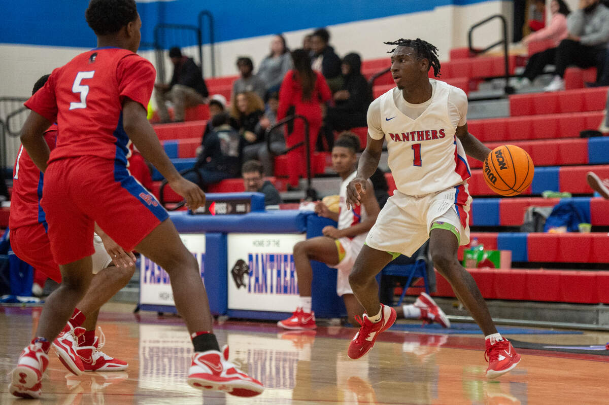 Pascagoula’s Dorrian McMillian dribbles the ball during a game against Pass Christian at Pascagoula High School on Tuesday, Dec. 20, 2022.