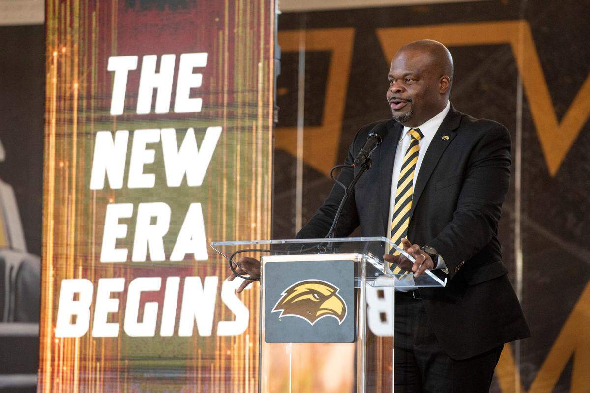 Southern Miss’ new head football coach Charles Huff makes an introductory speech during a public welcome celebration for Huff at The Rock in Hattiesburg on Thursday, Dec. 12, 2024.
