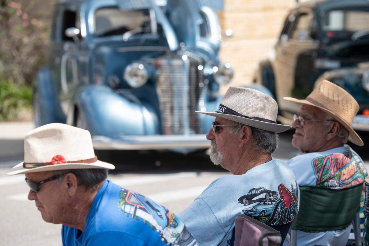 Spectators listen to live music during View the Cruise, one of the first events of Cruisin’ The Coast, in Gulfport on Sunday, Oct. 6, 2024.