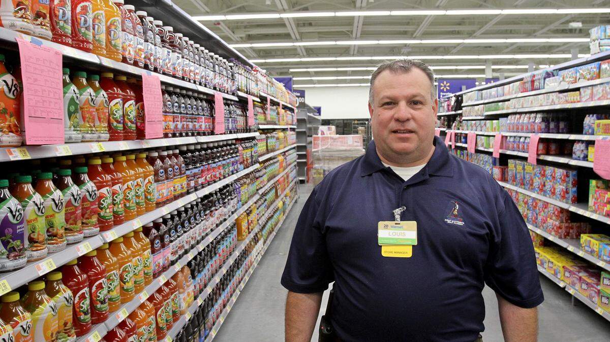 TIM ISBELL/SUN HERALDLouis Pellissier checks out the recently stocked aisles at the Wal-Mart Neighborhood Market on Popp's Ferry Road in Biloxi on Thursday.