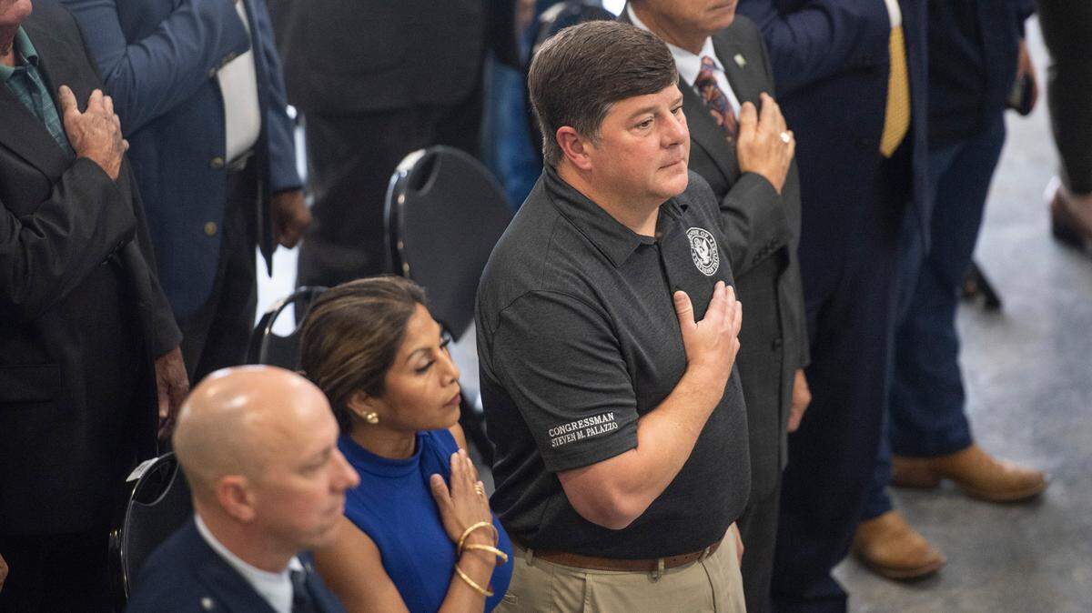 Congressman Steven Palazzo stands for the national anthem during a ribbon cutting ceremony for the new Division Street Gate at Keesler Air Force Base in Biloxi on Thursday, May 26, 2022.