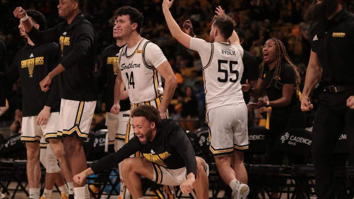 The Southern Miss bench celebrates during a win over South Alabama on Jan. 19, 2023.