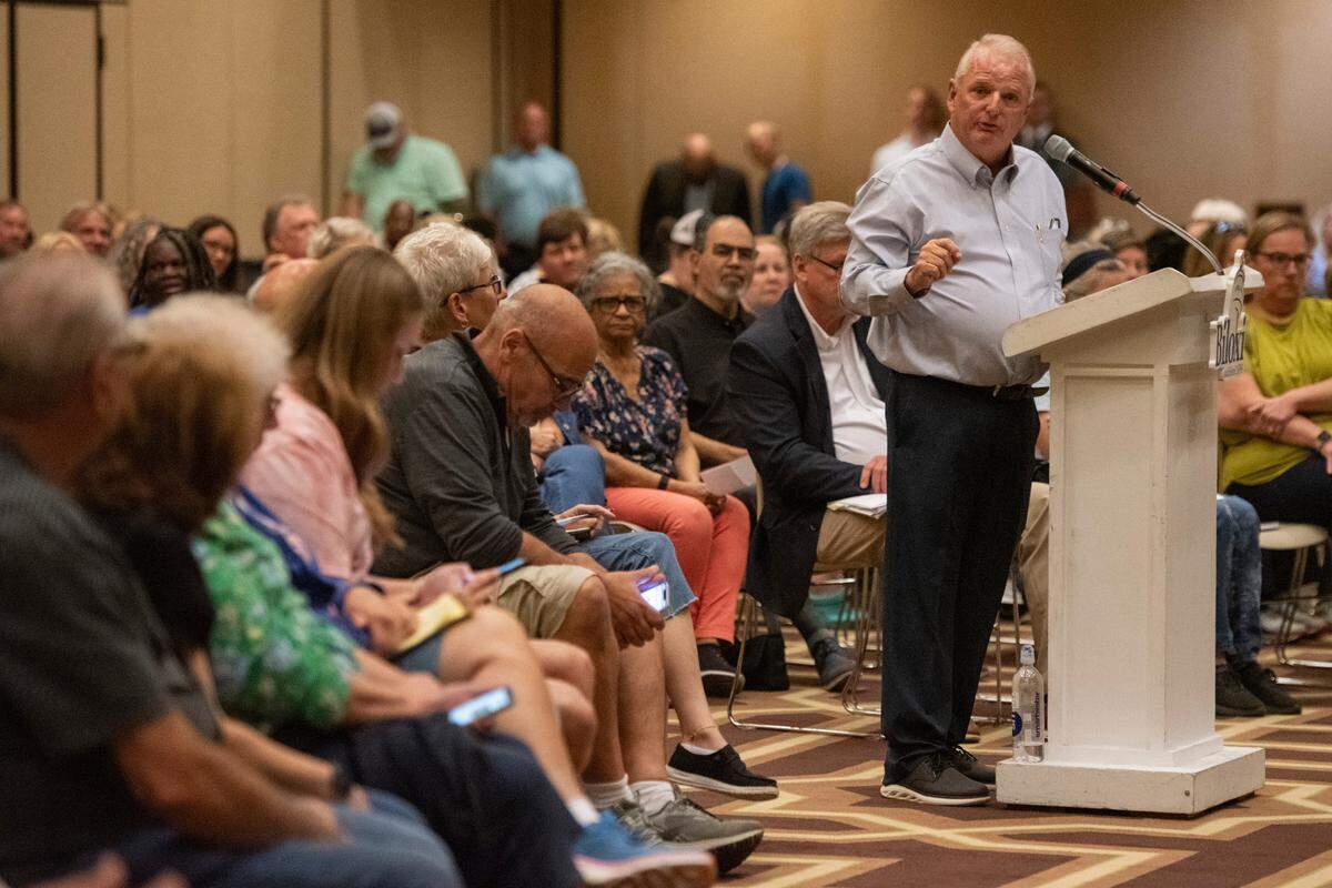 Andy Linville, a candidate for Biloxi mayor, speaks Tuesday evening, April 15, 2025, during a town hall meeting the City Council held about citywide homelessness.