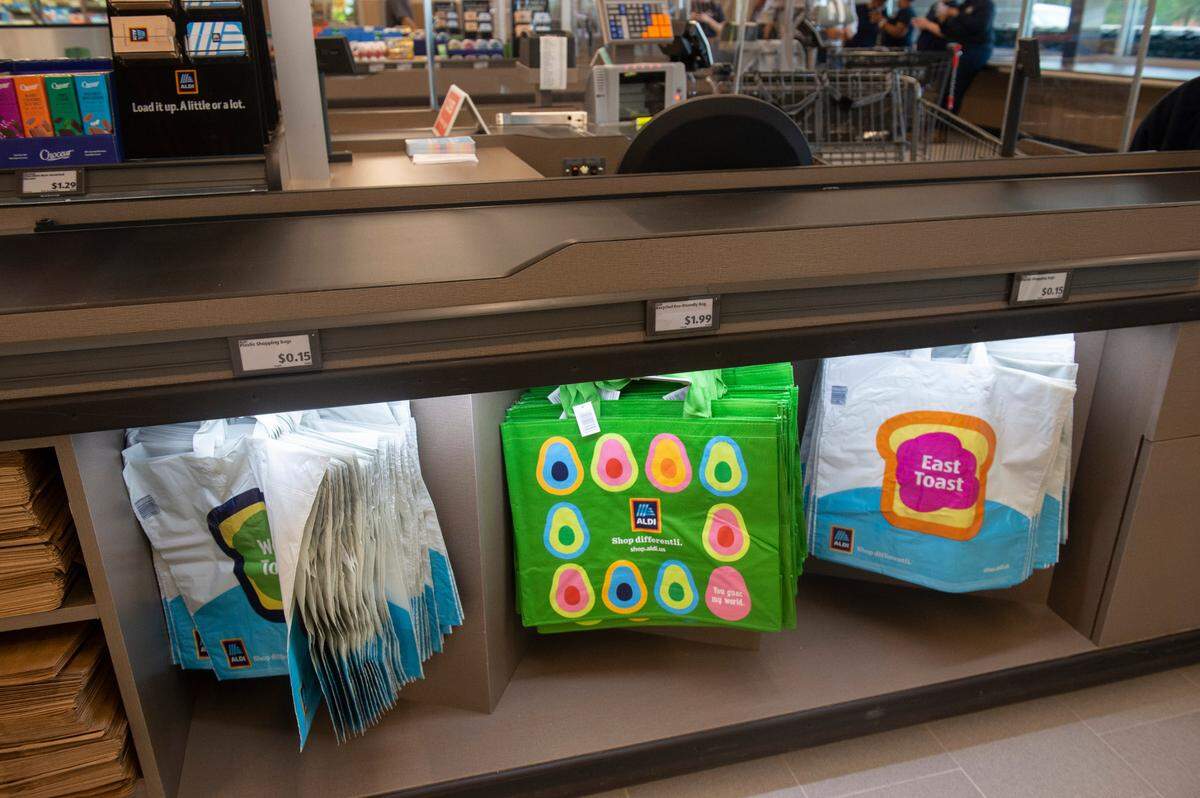 Bags for sale at a register at Aldi in Ocean Springs on Wednesday, Aug. 24, 2022. Aldi customers who want to use bags for their groceries have to either bring their own bags or purchase them.