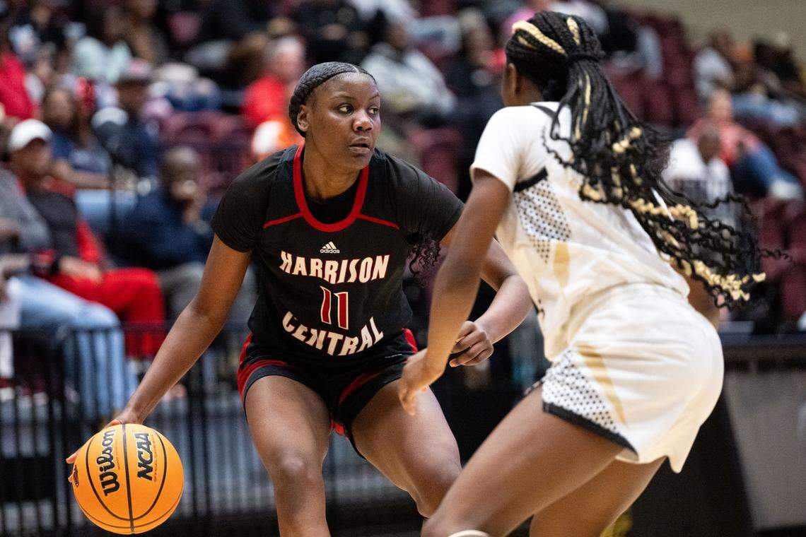 Harrison Central’s Janiyah Murray (11) dribbles the ball as she looks for a teammate to pass the ball to during a girls basketball game at Pearl River Community College on Friday, Feb. 27, 2026.