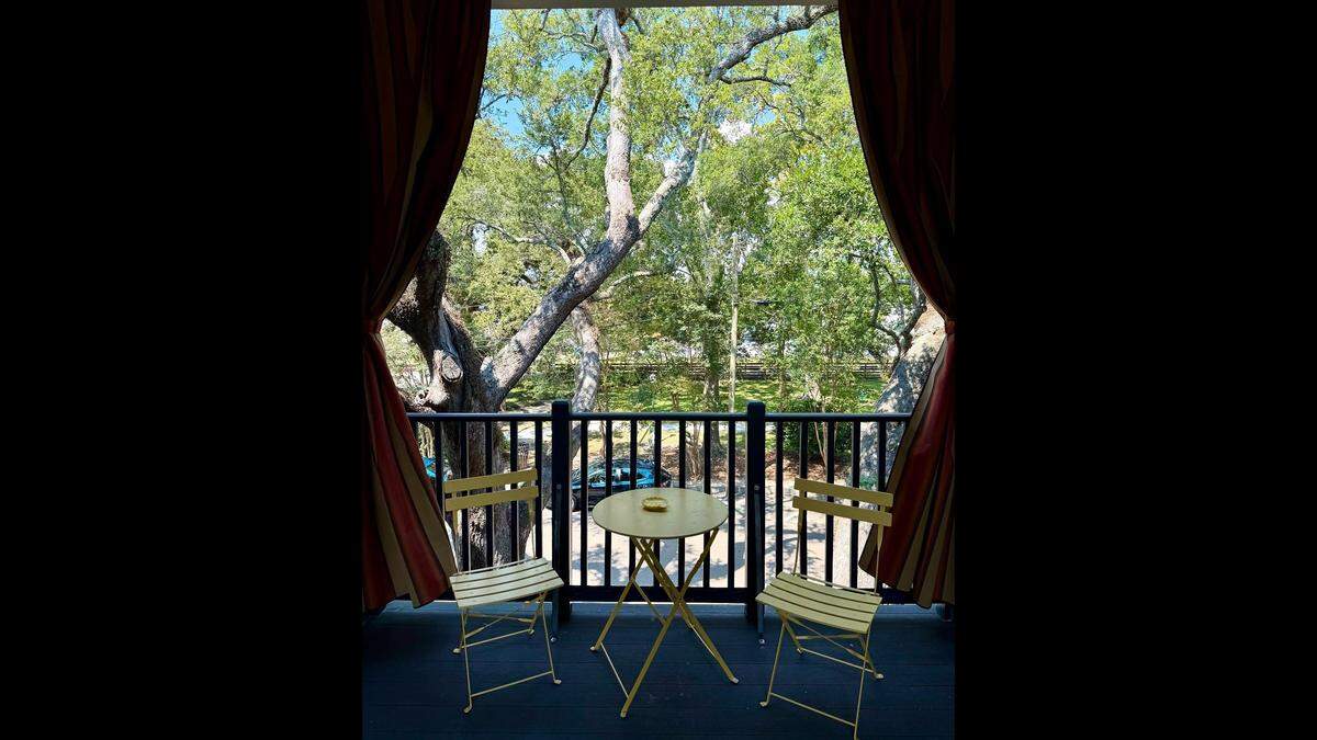 A balcony in the tress overlooks Ocean Springs at The Pullman House.