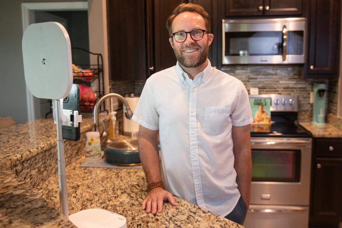 Matthew Bounds, also known as @yourbarefootneighbor on TikTok poses for a portrait in his kitchen where he films all his videos at his home in Gulfport on Friday, July 12, 2024.