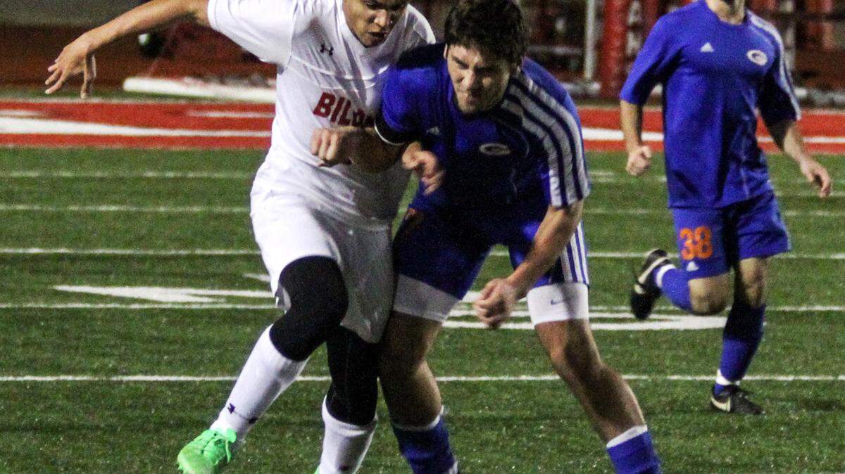 CHRISTOPHER BOSTICK/SUNHERALD 
 Biloxiís Brenan Burrey and Gulfportís Alexander Hopkins battle for possession Tuesday, Jan. 19. 2016, in Biloxi.