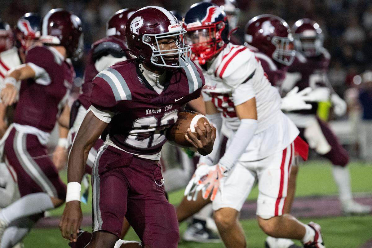 Picayune running back Jamari Hathorne (22) finds open space Friday against Hancock.