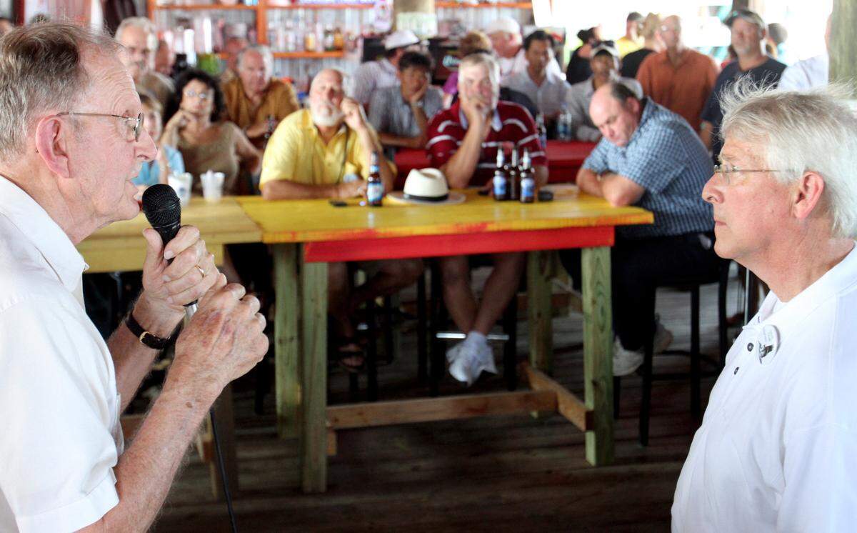 Victor Mavar of Biloxi, left, asks U.S. Sen. Roger Wicker about foreign boats capable of helping clean oil that are prohibited from working in U.S. waters during a town-hall meeting about the Deepwater Horizon oil spill with at Shaggy’s restaurant in Pass Christian.