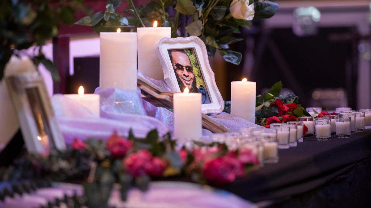 A photo of Randy Johnson is surrounded by lit candles Tuesday during a ceremony as a part of National Crime Victims’ Rights Week at First Baptist Church of Gulfport. Randy Johnson, 41, was shot and killed in 2021 at the Golden Nugget Casino in Biloxi.