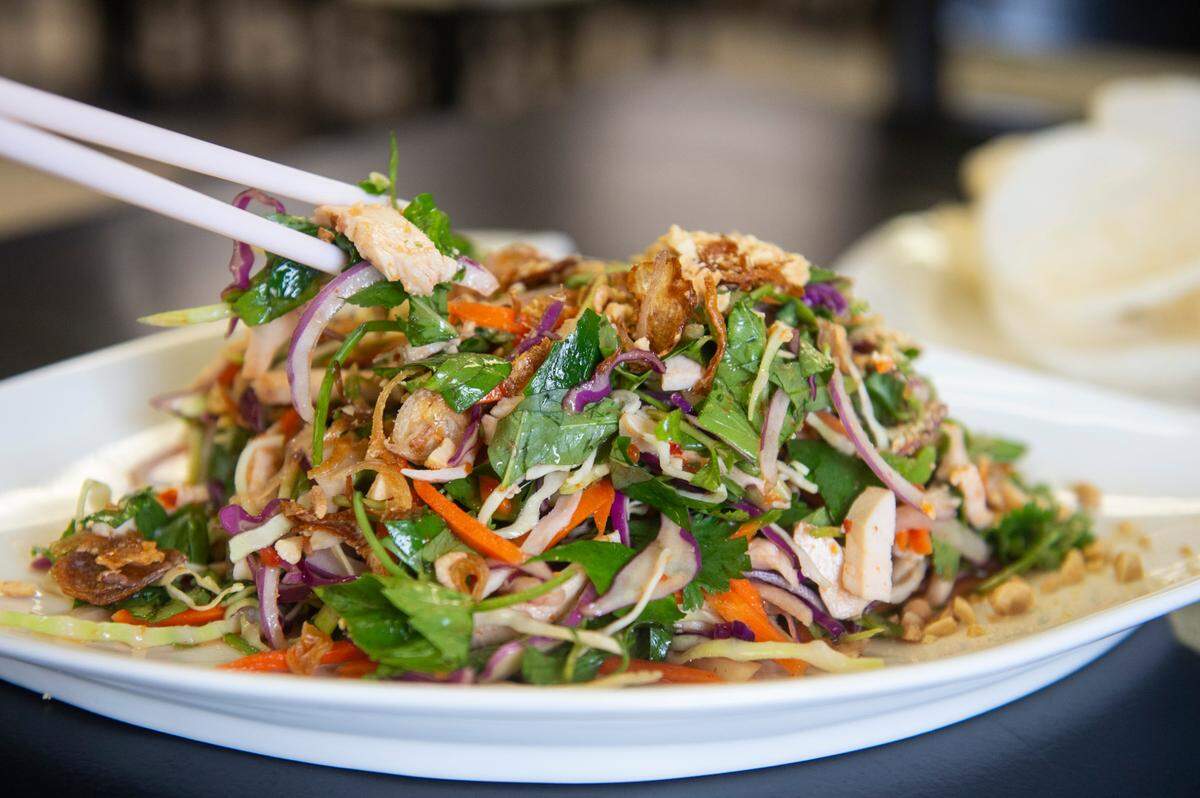 The Ngo Sen Tom salad, which consists of lotus root salad mixed with sliced pork, shrimp, basil, cilantro and onion, is one of 100 selections on the menu at Hana Pho’s new location on Division Street in Biloxi.