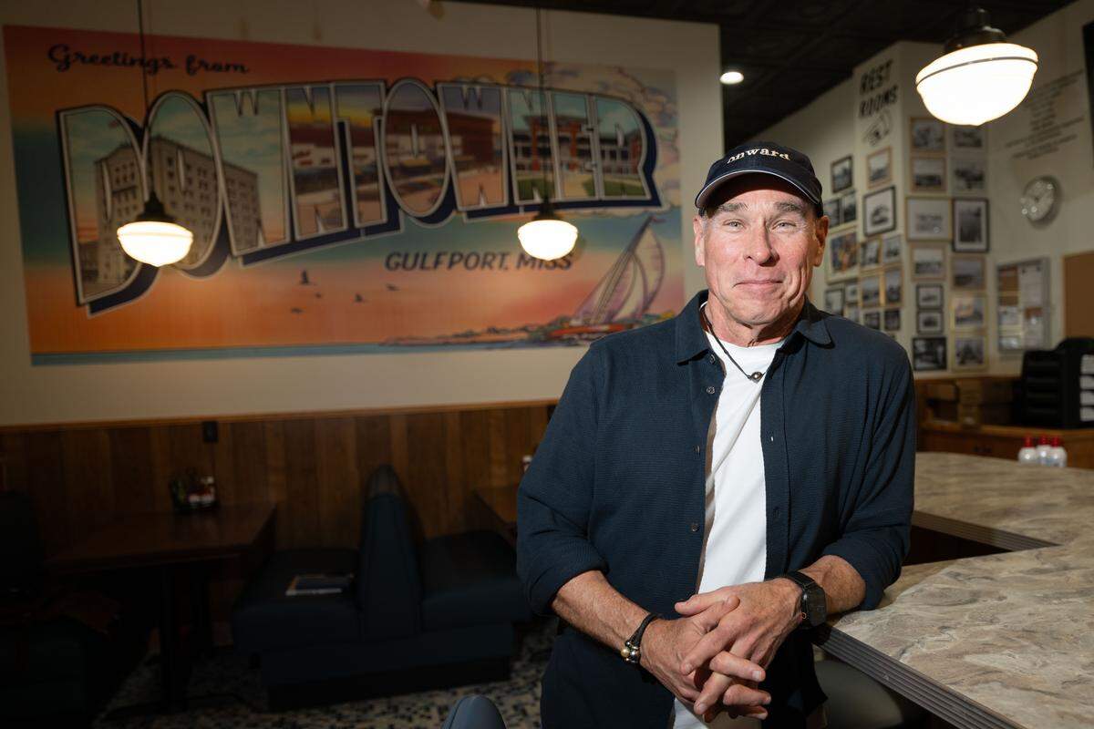 A Gulfport mural decorates The Downtowner, the new restaurant Robert St. John is opening in downtown Gulfport. A huge collection of old Gulfport photos also decorates the walls.