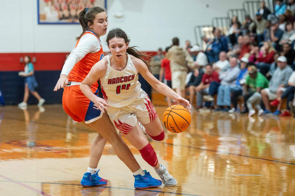 Hancock’s Anslee James falls during a game against Gulfport at Hancock High School in Kiln on Tuesday, Jan. 10, 2023.