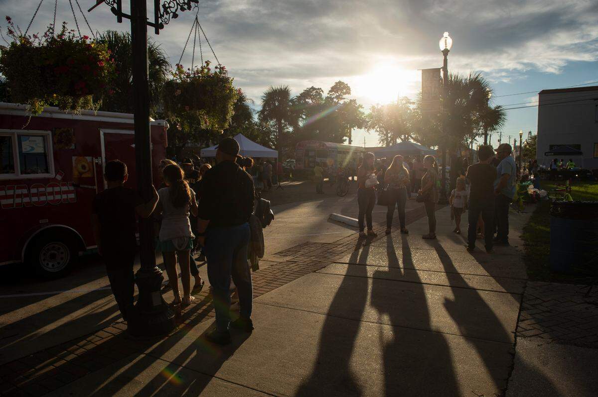 People wait in line at food vendors during the Festival Hispano de Pascagoula in Pascagoula on Friday, Sept. 24, 2021.