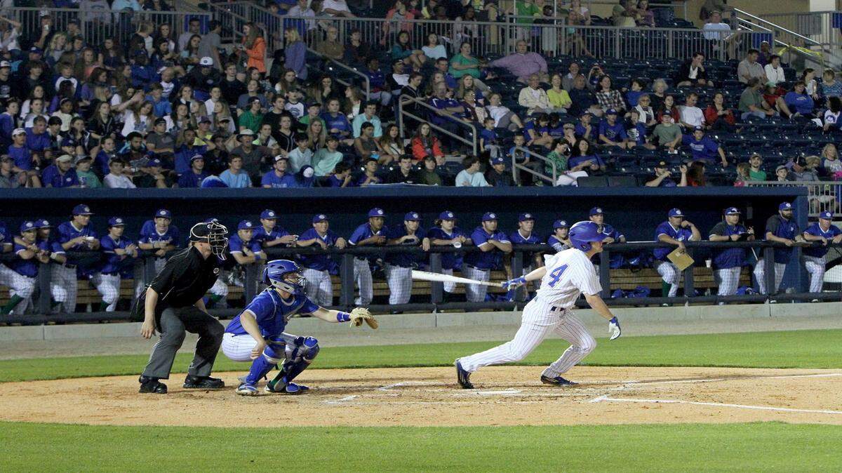 JOHN FITZHUGH/SUN HERALD 
 Gulfport's Blake Johnson watches his hit during their game against Ocean Springs at MGM Park in Biloxi on March 17.