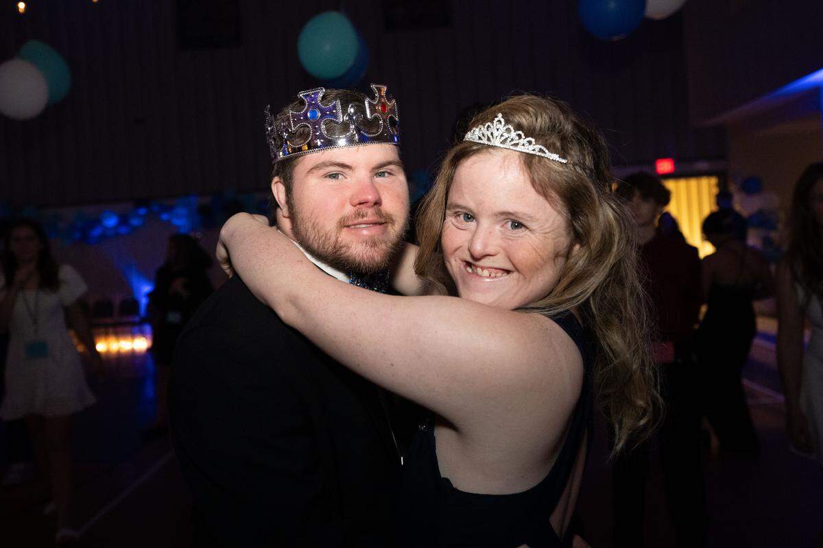 Noah Duffy, left, and Dani Chase, right, dance together during Night to Shine at Woolmarket Baptist Church on Friday, Feb. 13, 2026.