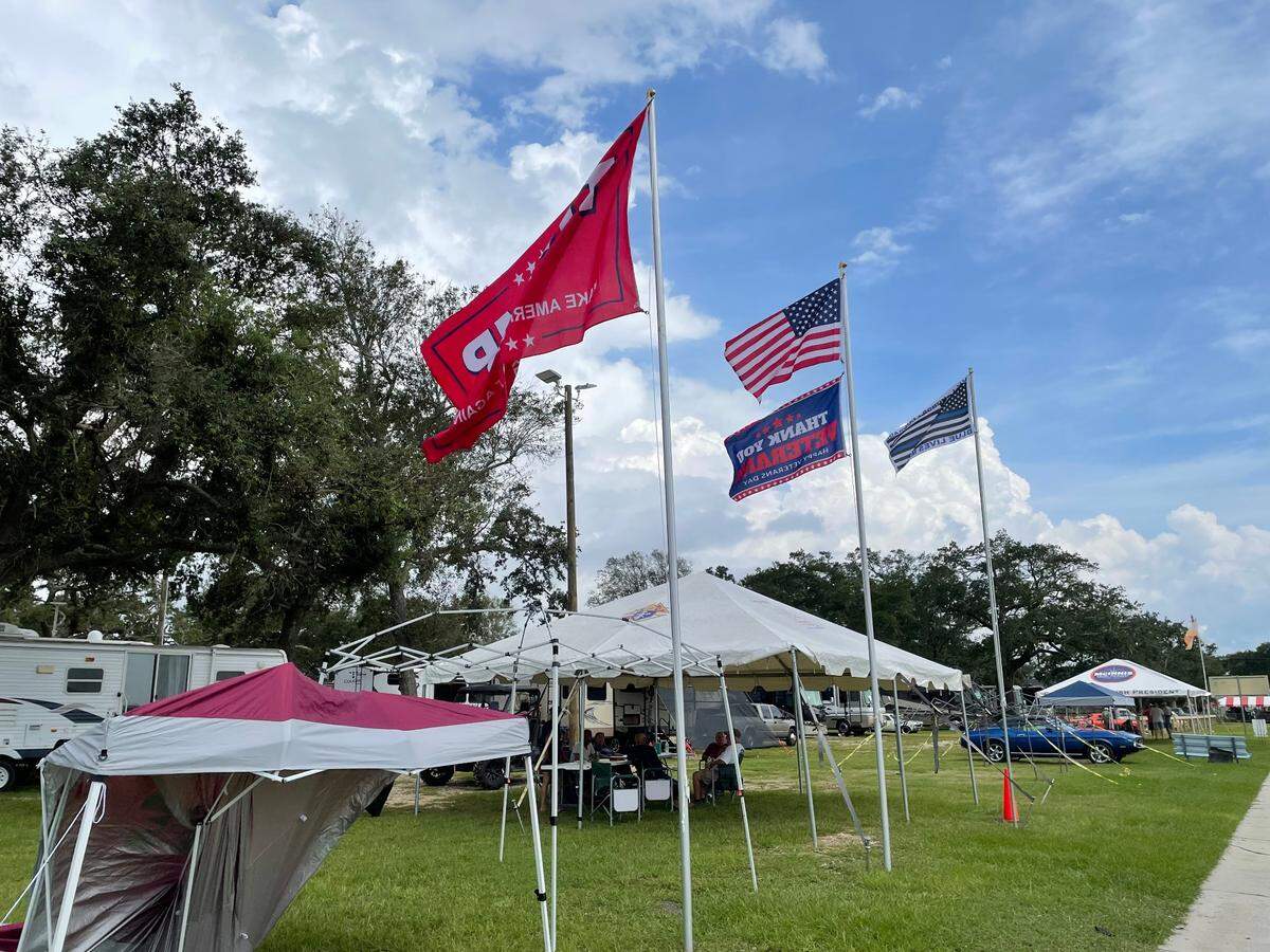 A flag display at a campsite near Big Play for Cruisin’ The Coast includes a Trump 2024 flag, the U.S. flag, a Blue Lives Matter flag and a flag for veterans.