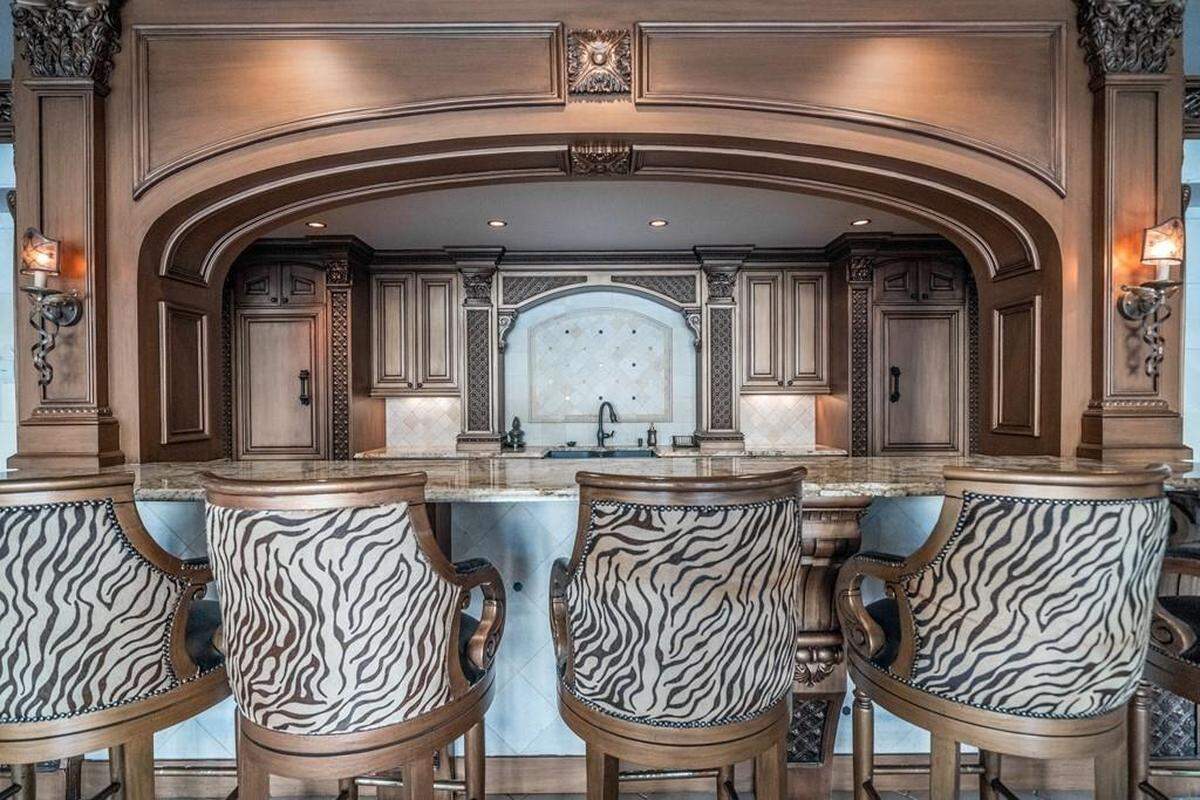 There’s room to chop it up with guests in any of the home’s seven kitchens.