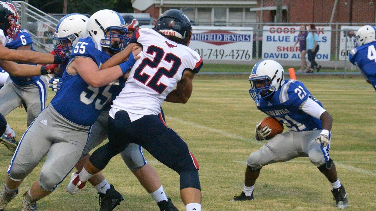 Pearl River Central’s Detrich Spikes (21) looks for room to run as Hancock’s Colby McGough closes in on Friday in Carriere.