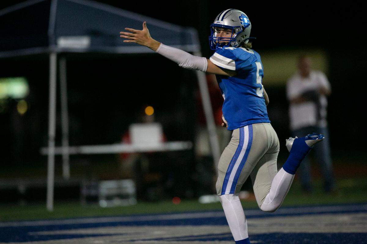 Ocean Springs’ Bray Hubbard celebrates as he runs into the end zone for a touchdown during the matchup between Ocean Springs and Hancock at Greyhound Stadium in Ocean Springs on Friday, Sept. 24, 2021.