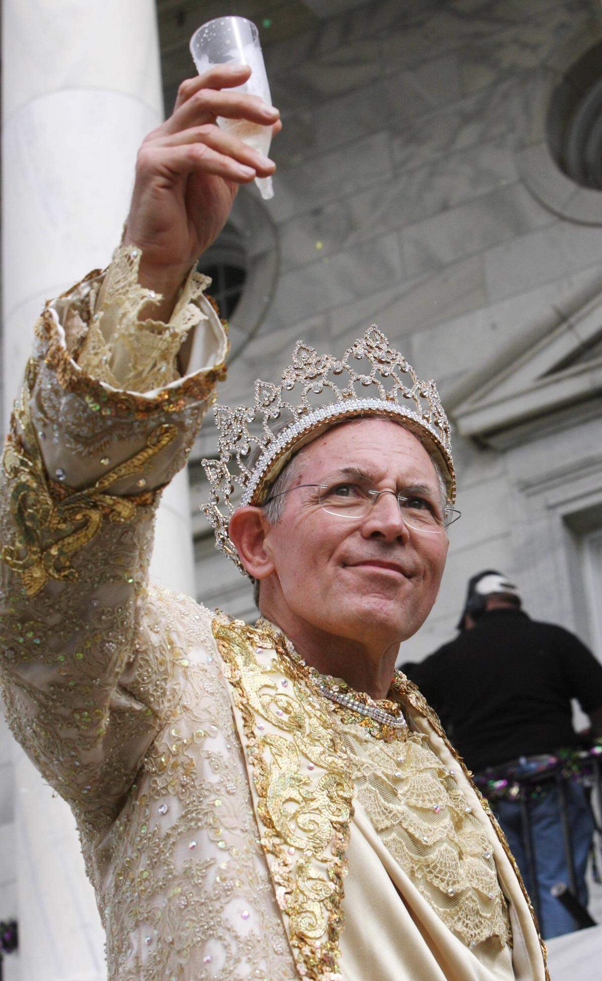 Gulf Coast Carnival Association King d’Iberville Ron Peresich toasts his queen in 2008 during the GCCA/Neptune Mardi Gras parade in Biloxi.