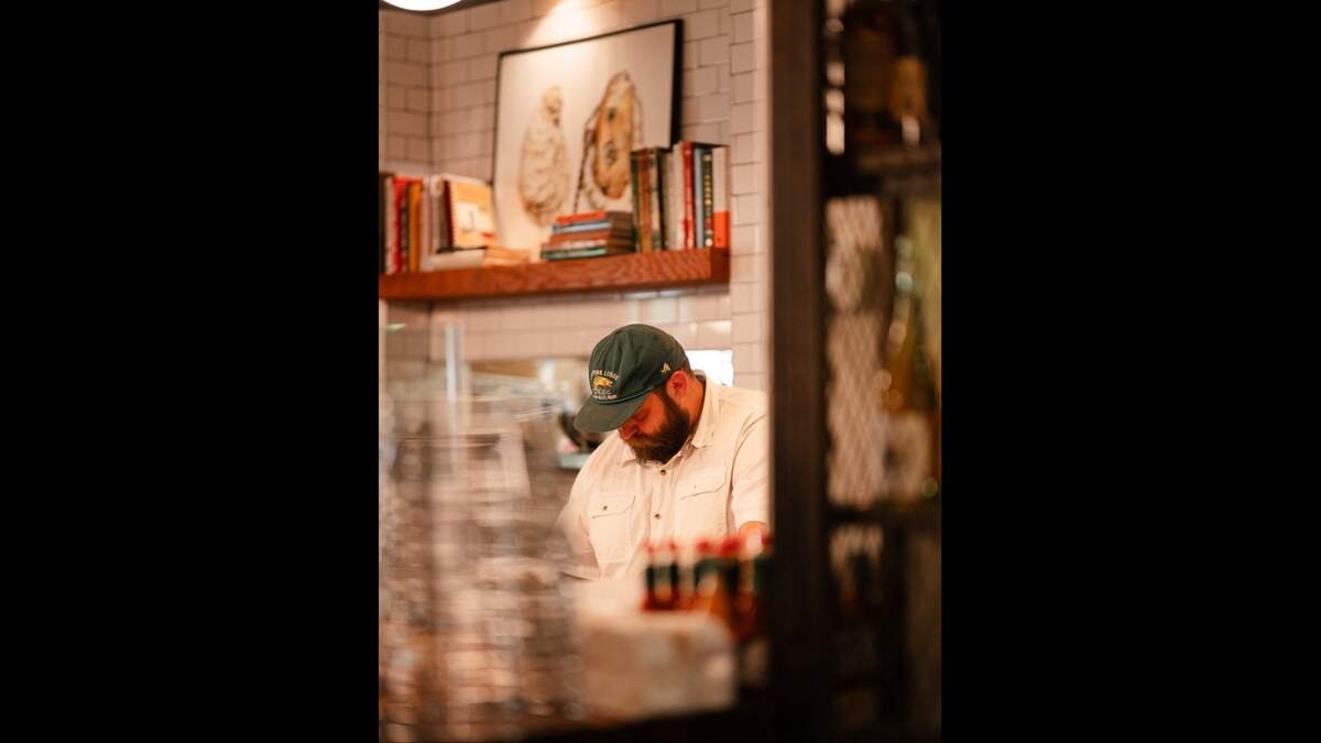 Chef Lucas McKinney prepares Gulf Coast dishes at Josephine’s Gulf Coast Tradition restaurant in Houston. He grew up in Ocean Springs.