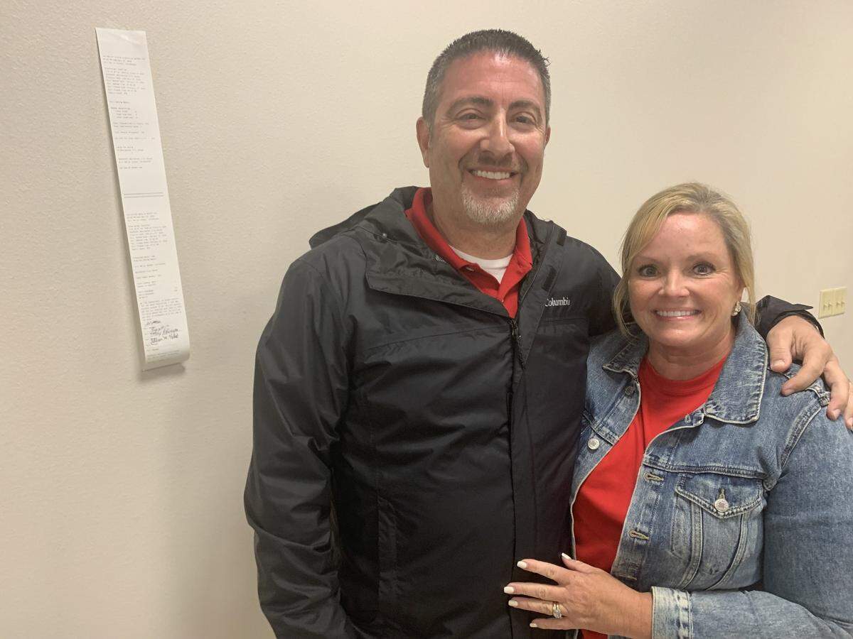 David Shoemaker hugs his wife Gwen after reading the results posted on the wall, showing he is the winner of Tuesday’s special election for Ward 7 Biloxi Council,