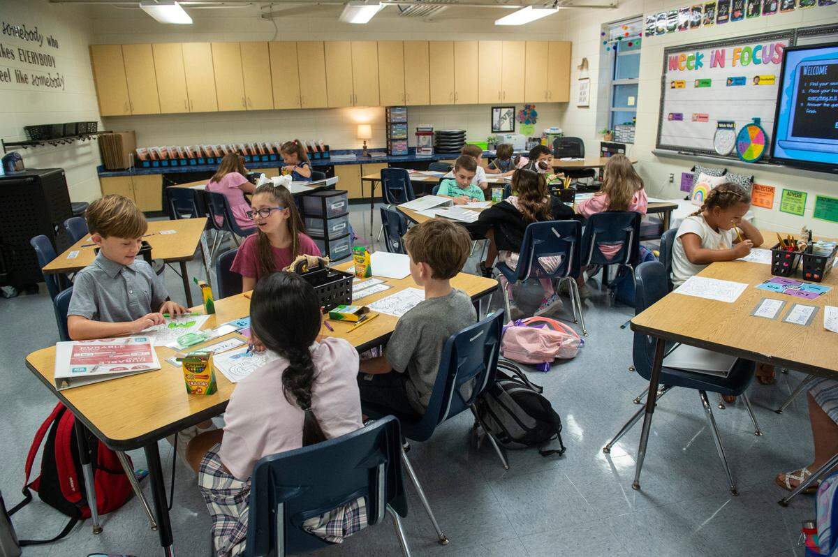 Students at Magnolia Park Elementary in Ocean Springs fill out a first day of school coloring sheet on Friday, Aug. 5, 2022.