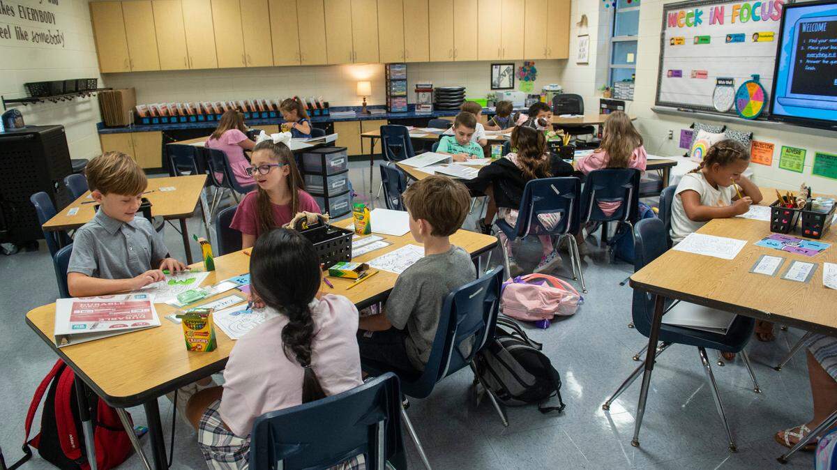 Students at Magnolia Park Elementary in Ocean Springs fill out a first day of school coloring sheet on Friday, Aug. 5, 2022. The city miscalculated tax rates, leaving the school district $475,000 short. The district will borrow the money, with city taxpayers repaying the loan over three coming years.