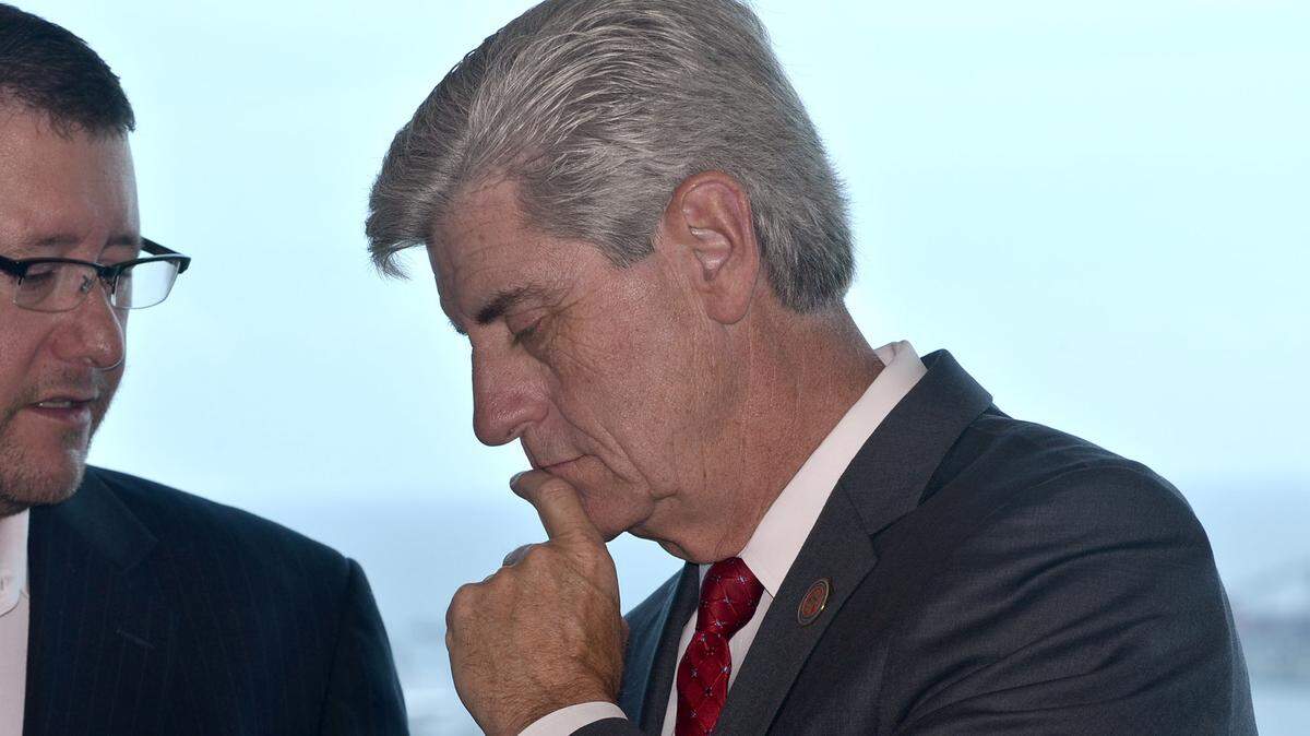 TIM ISBELL/SUN HERALD 
 Gov. Phil Bryant talks with Kip Gregory after a press conference in which Republican leaders stressed their opposition to Initiative 42, Thursday, Oct. 22, 2015.