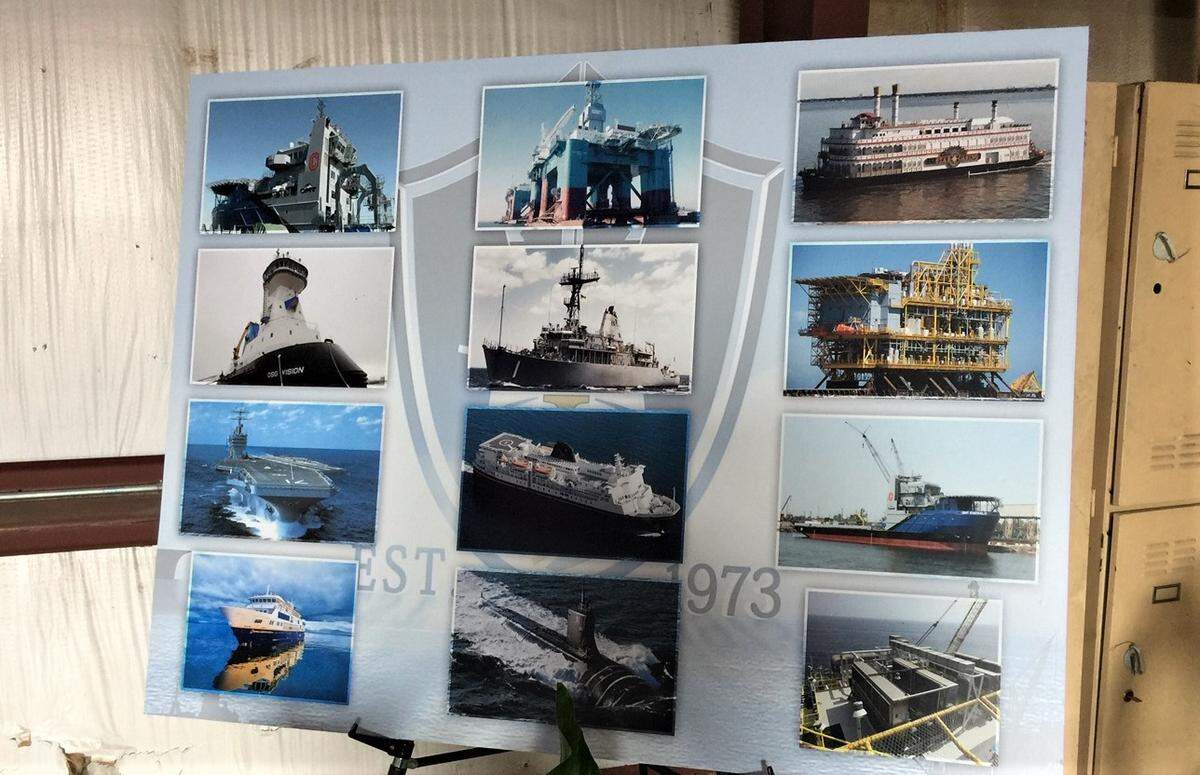 VT Halter Marine displayed photographs of the various types of ships it builds during a press conference Jackson County.