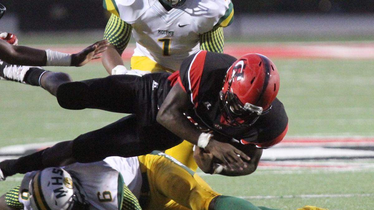 JOHN FITZHUGH/SUN HERALD 
 Running back Keon Moore (center) has established himself as Harrison Central's leading running back. The Red Rebels host Petal in the Class 6A playoff opener on Friday.