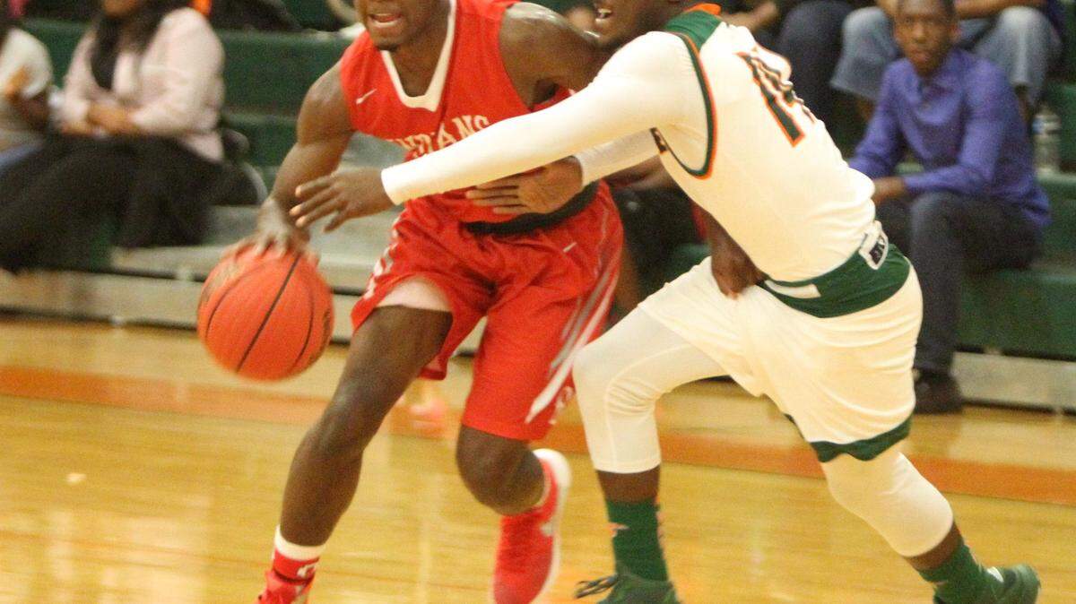 JOHN FITZHUGH/SUN HERALD 
 Biloxi's Jordan Lewis dribbles past West Harrison's Hakeem Wilson during the first quarter of their game at West Harrison on Tuesday Nov. 16, 2015.