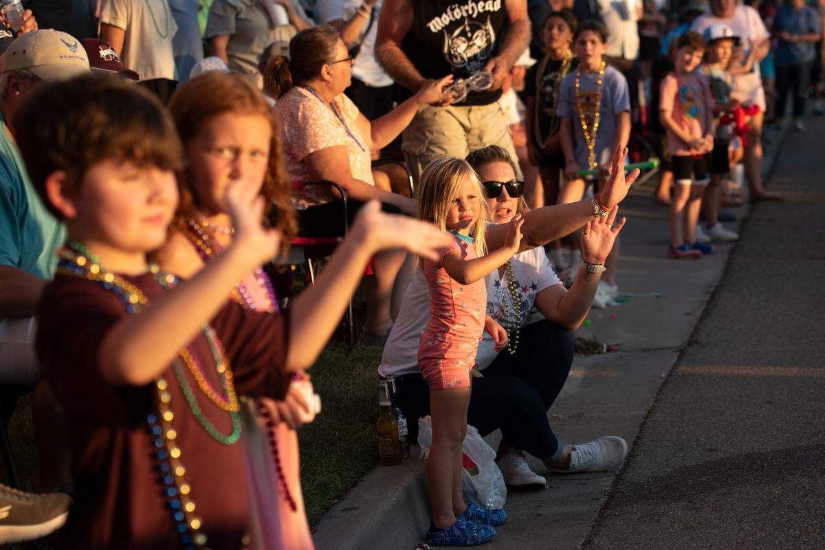 Spectators wave to the Cruisers during the Long Beach Parade in Long Beach, one of the events in Cruisin’ The Coast, on Monday, Oct. 7, 2024.