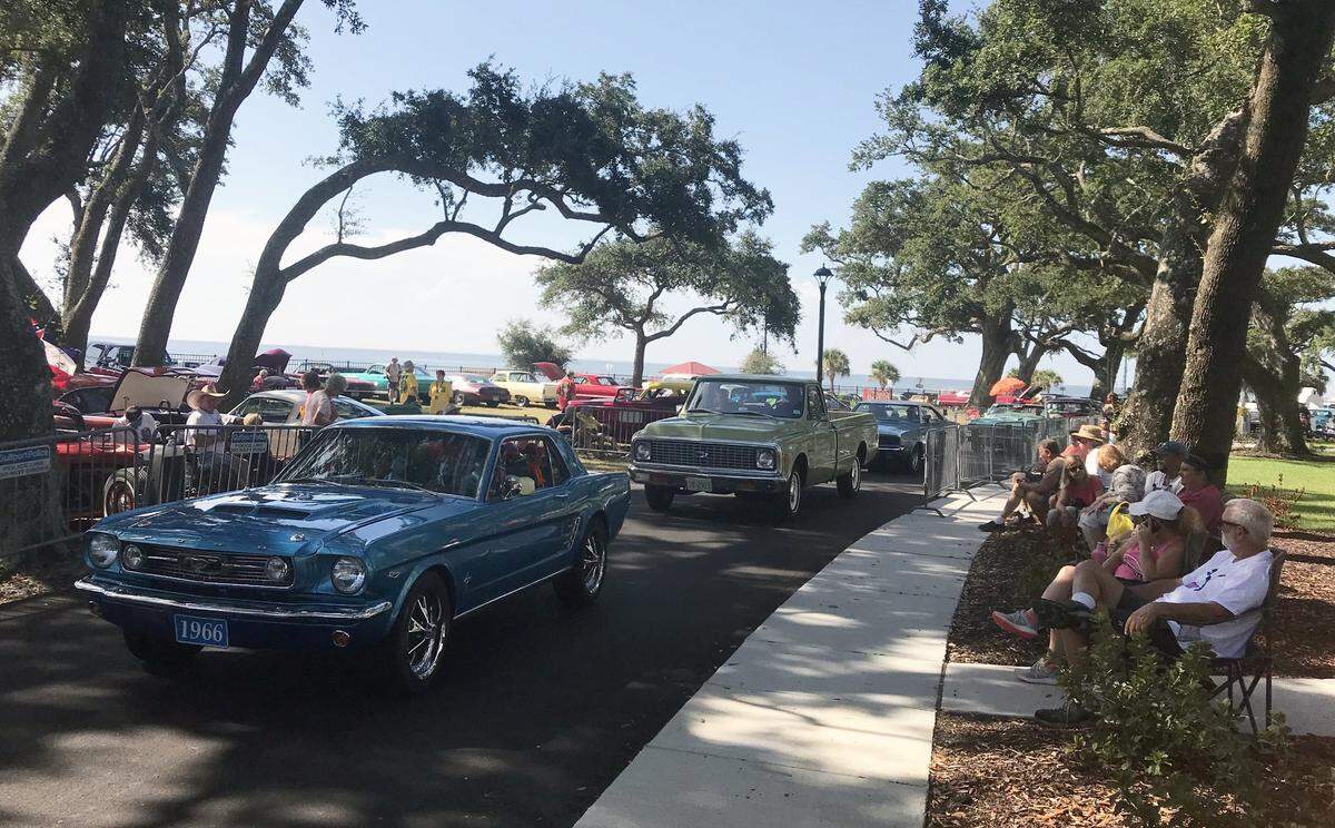 Cruisers file into Cruise Central at the new Centennial Plaza as spectators watch on the second day of Cruisin’ The Coast 2019 on Monday morning, Oct. 7, 2019.