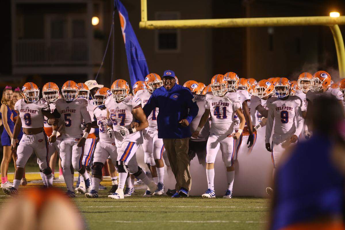 Gulfport head coach John Archie leads the Admirals out on the field to face D’Iberville October 25, 2019.